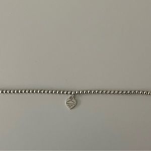 Tiffany’s sterling silver beaded bracelet with blue heart. Excellent condition.